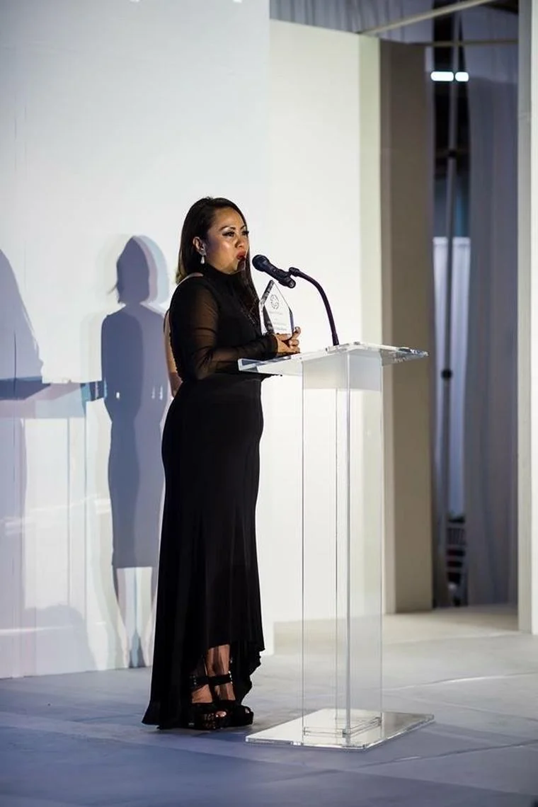 Accepting the Against The Grain Groundbreaker Award on stage