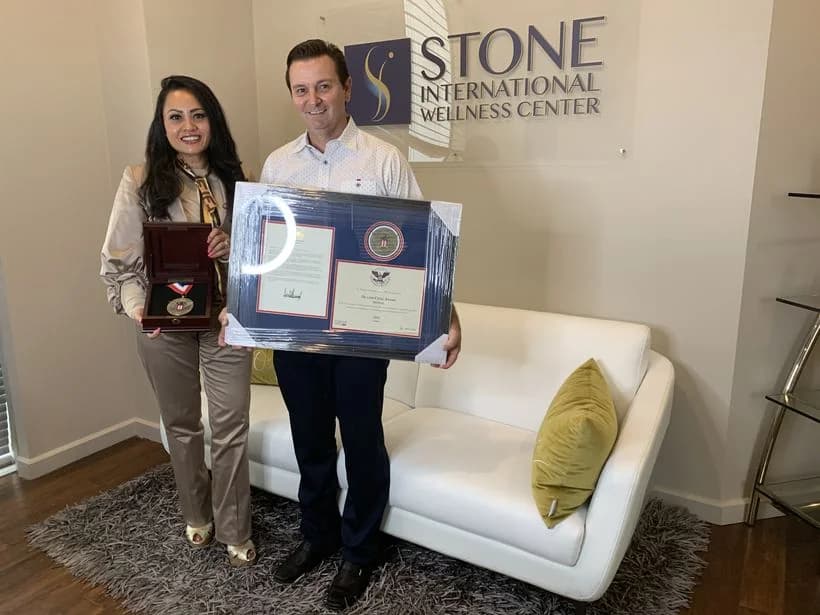 With the framed presidential certificate and medal